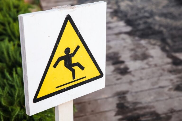 A caution sign illustrating a man falling